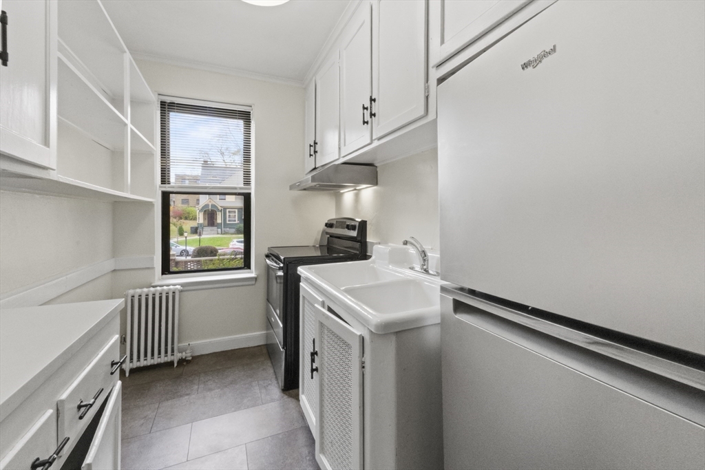 38-40 Cedar Street, Unit 335 Worcester, MA 01609 - Photo 6 of 21 a utility room with dryer and washer