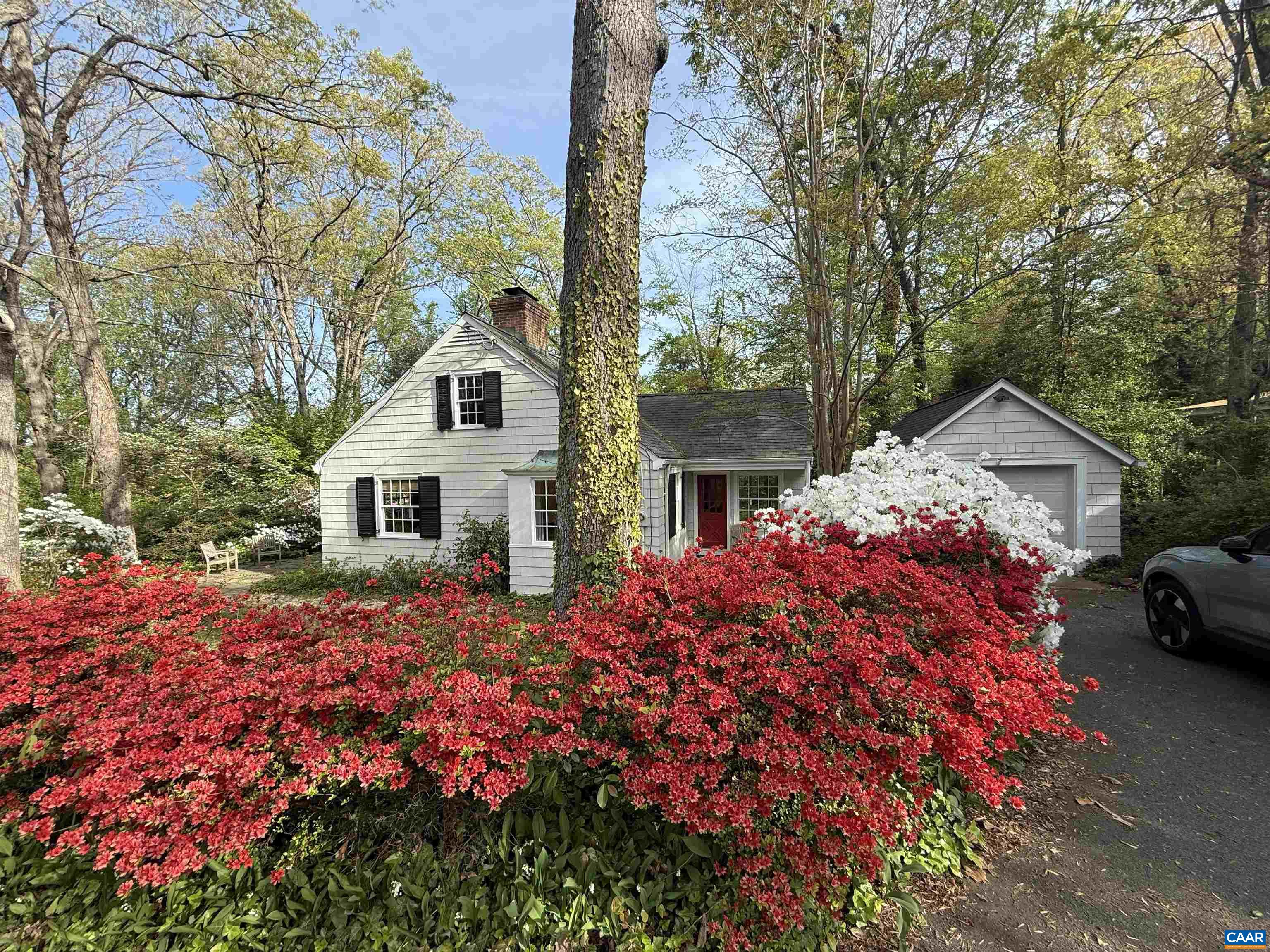 1426 Dairy Road Charlottesville, VA 22903 - Photo 1 of 48 a front view of a house with a yard and garage