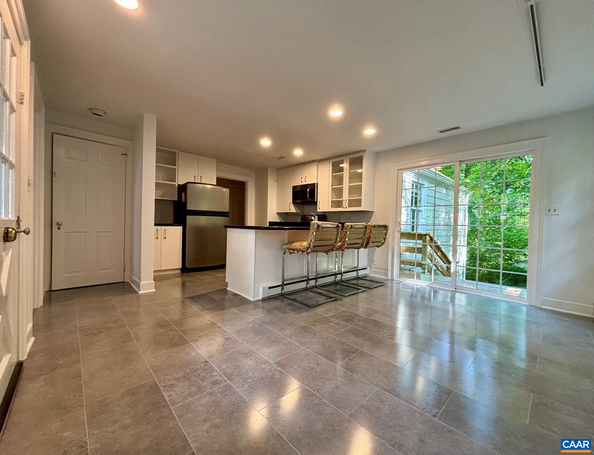 1426 Dairy Road Charlottesville, VA 22903 - Photo 13 of 48 a view of a kitchen with furniture and floor to ceiling window