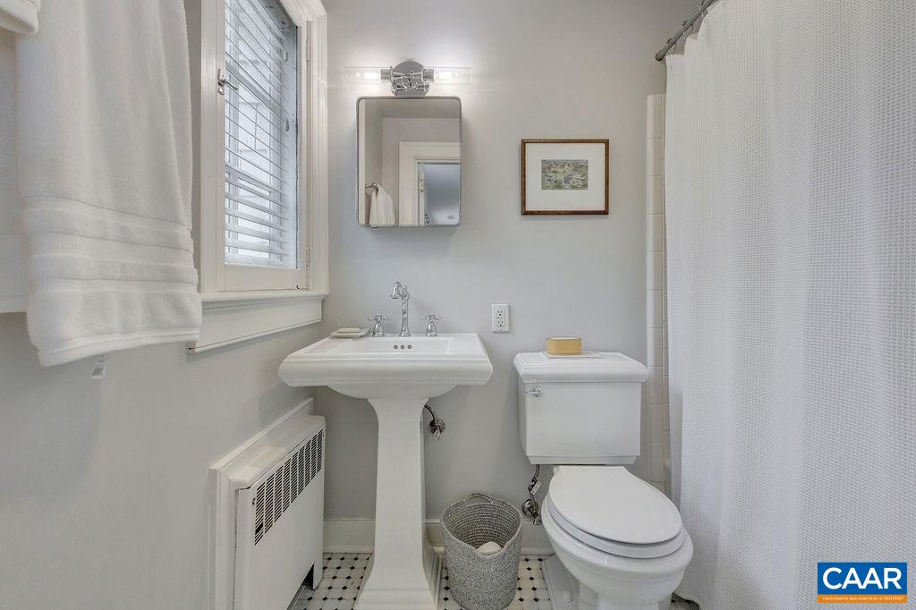 1426 Dairy Road Charlottesville, VA 22903 - Photo 21 of 48 a white toilet sitting next to a bathroom sink