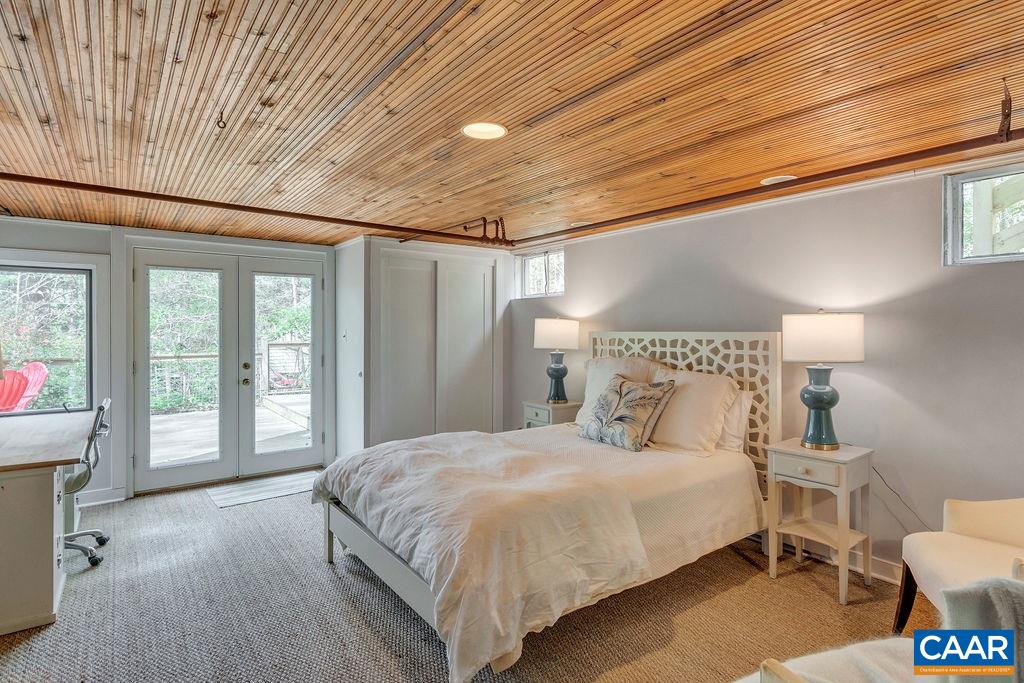 1426 Dairy Road Charlottesville, VA 22903 - Photo 23 of 48 a bedroom with a large bed and a large window