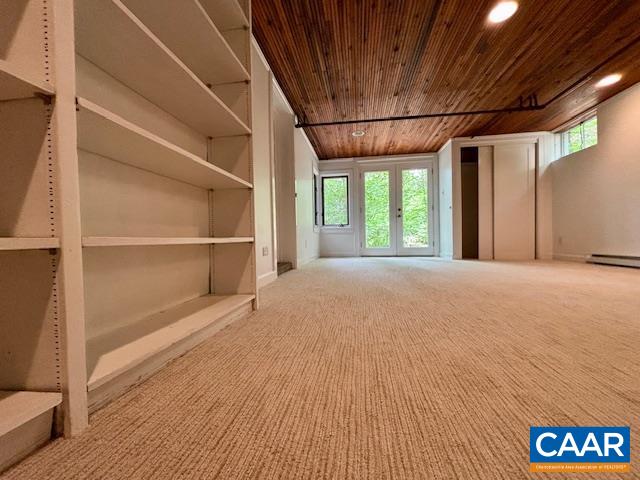 1426 Dairy Road Charlottesville, VA 22903 - Photo 25 of 48 a view of an empty room with a window and wooden floor