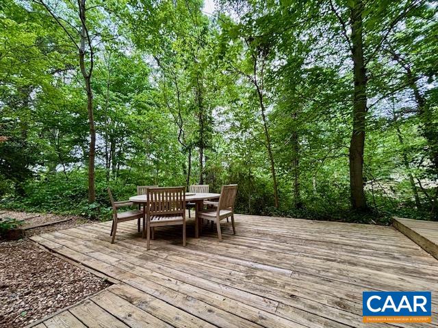1426 Dairy Road Charlottesville, VA 22903 - Photo 29 of 48 a view of backyard with table and chairs and wooden floor