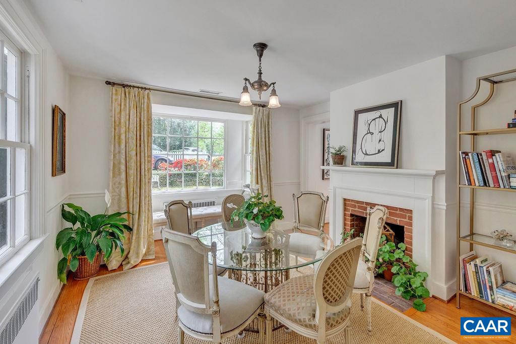 1426 Dairy Road Charlottesville, VA 22903 - Photo 10 of 48 a dining room with furniture potted plants and wooden floor