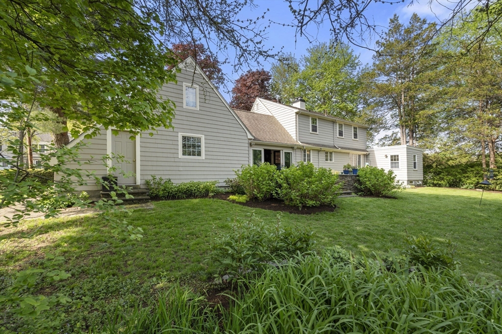 53 Enslin Road Needham, MA 02492 - Photo 23 of 28 a house view with a garden space