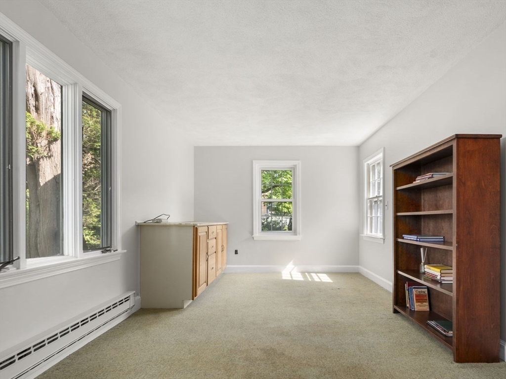 53 Enslin Road Needham, MA 02492 - Photo 8 of 28 an empty room with windows and closet