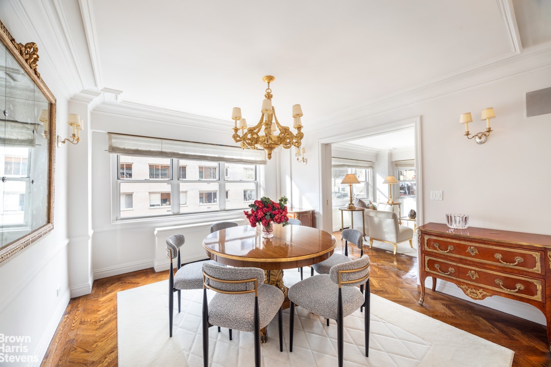 27 East 65th Street, Unit 9DE Manhattan, NY 10065 - Photo 3 of 14 a dining room with furniture and window