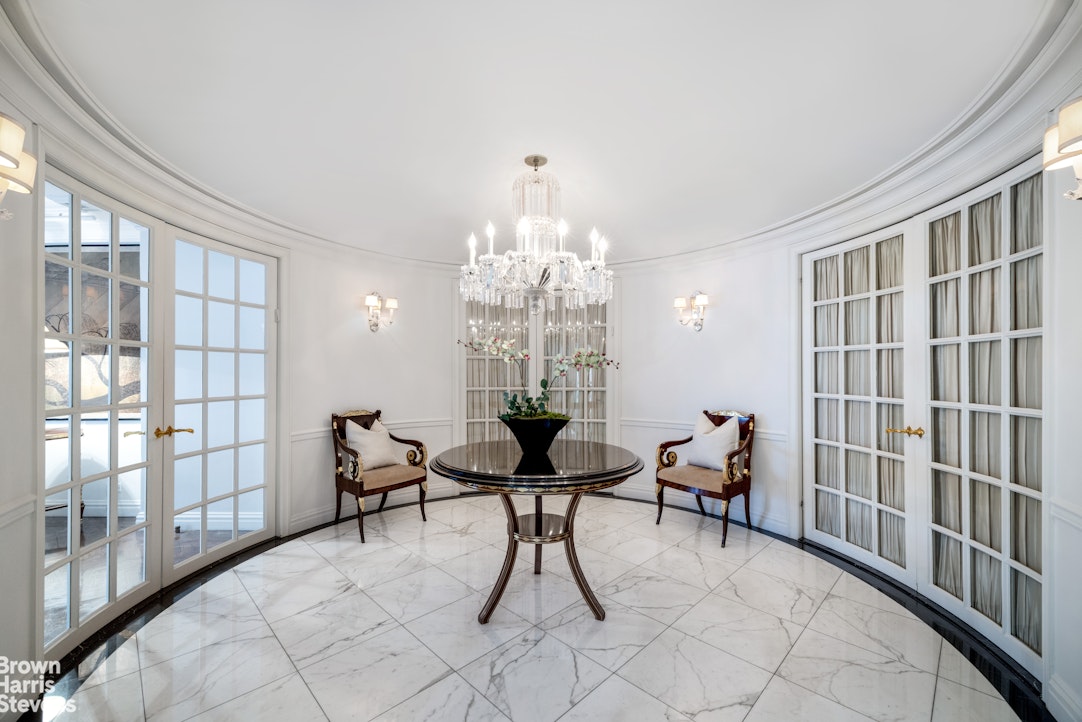 27 East 65th Street, Unit 9DE Manhattan, NY 10065 - Photo 5 of 14 a view of a livingroom with furniture and window
