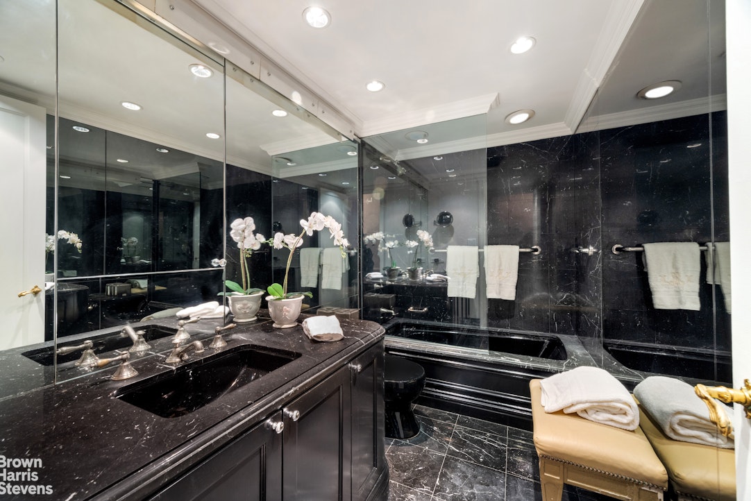 27 East 65th Street, Unit 9DE Manhattan, NY 10065 - Photo 9 of 14 a kitchen with a sink and cabinets