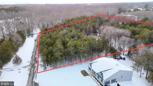 a view of a park with iron fence