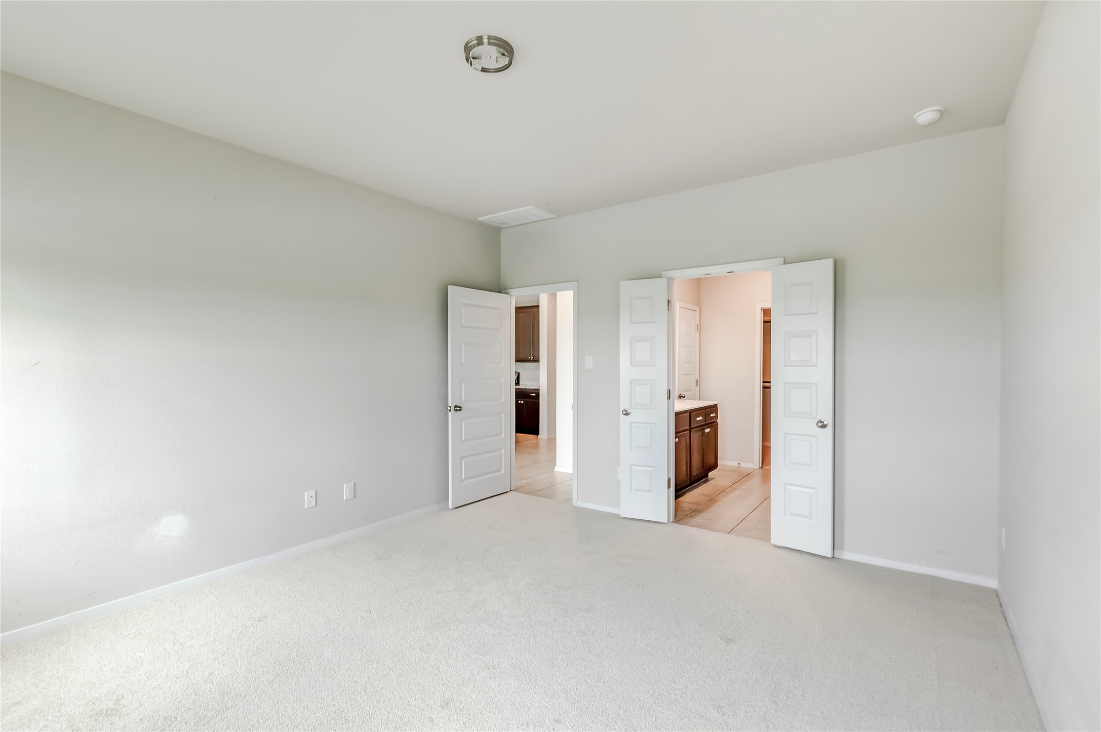 2721 Winding Creek Road Kyle, TX 78640 - Photo 15 of 27 Spacious room featuring light-colored carpet flooring and neutral wall tones