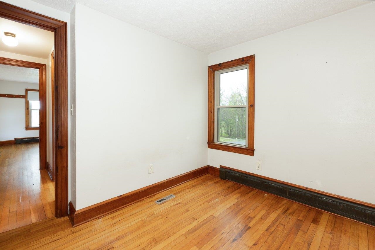 547 Grindstone Road Bridgewater, VA 22812 - Photo 17 of 57 a view of an empty room with wooden floor and a window