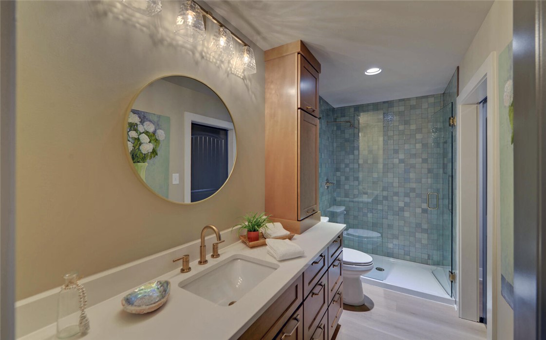 398 Hidden Point Road Hartwell, GA 30643 - Photo 18 of 46 This primary bathroom features modern amenities and a refreshing design.