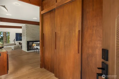 a view of a livingroom with wooden floor and fireplace