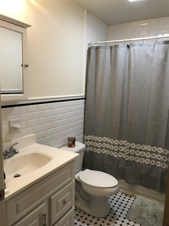 608 Jefferson Street, Unit 3 Hoboken, NJ 07030 - Photo 11 of 14 a bathroom with a sink toilet and shower