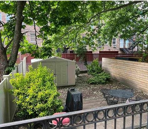 608 Jefferson Street, Unit 3 Hoboken, NJ 07030 - Photo 12 of 14 a backyard of a house with lots of green space