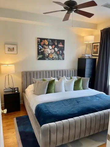 a white toilet sitting next to a shower curtain