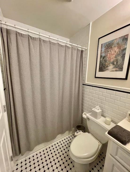 608 Jefferson Street, Unit 3 Hoboken, NJ 07030 - Photo 10 of 14 a white toilet sitting next to a shower curtain