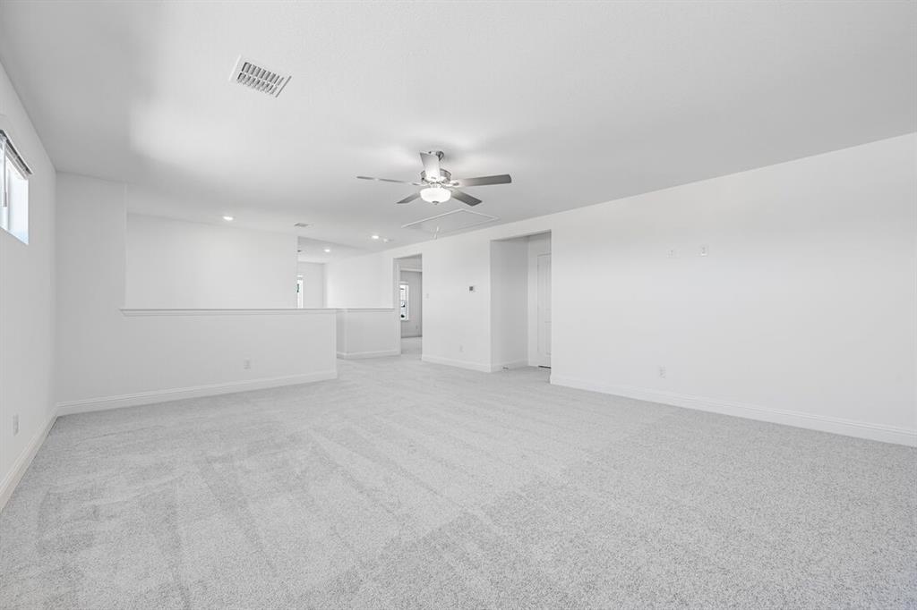 1429 Arciones Road Fort Worth, TX 76052 - Photo 25 of 39 wooden floor in an empty room with a window