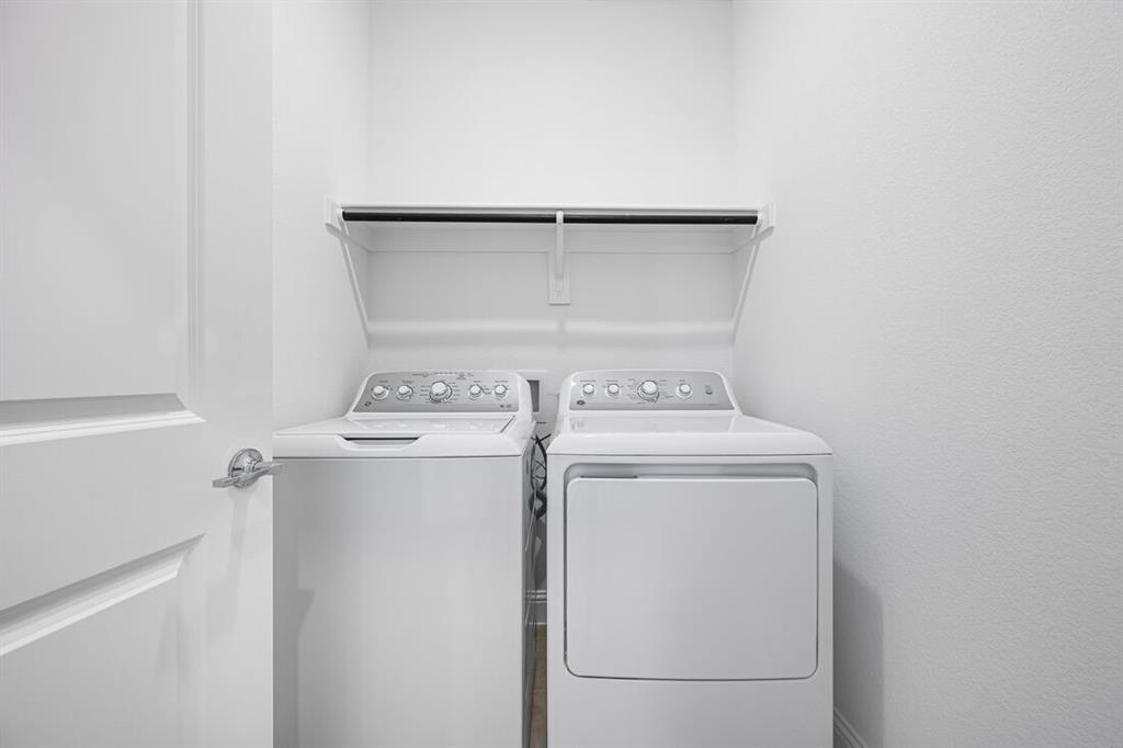 1429 Arciones Road Fort Worth, TX 76052 - Photo 27 of 39 a utility room with dryer and washer