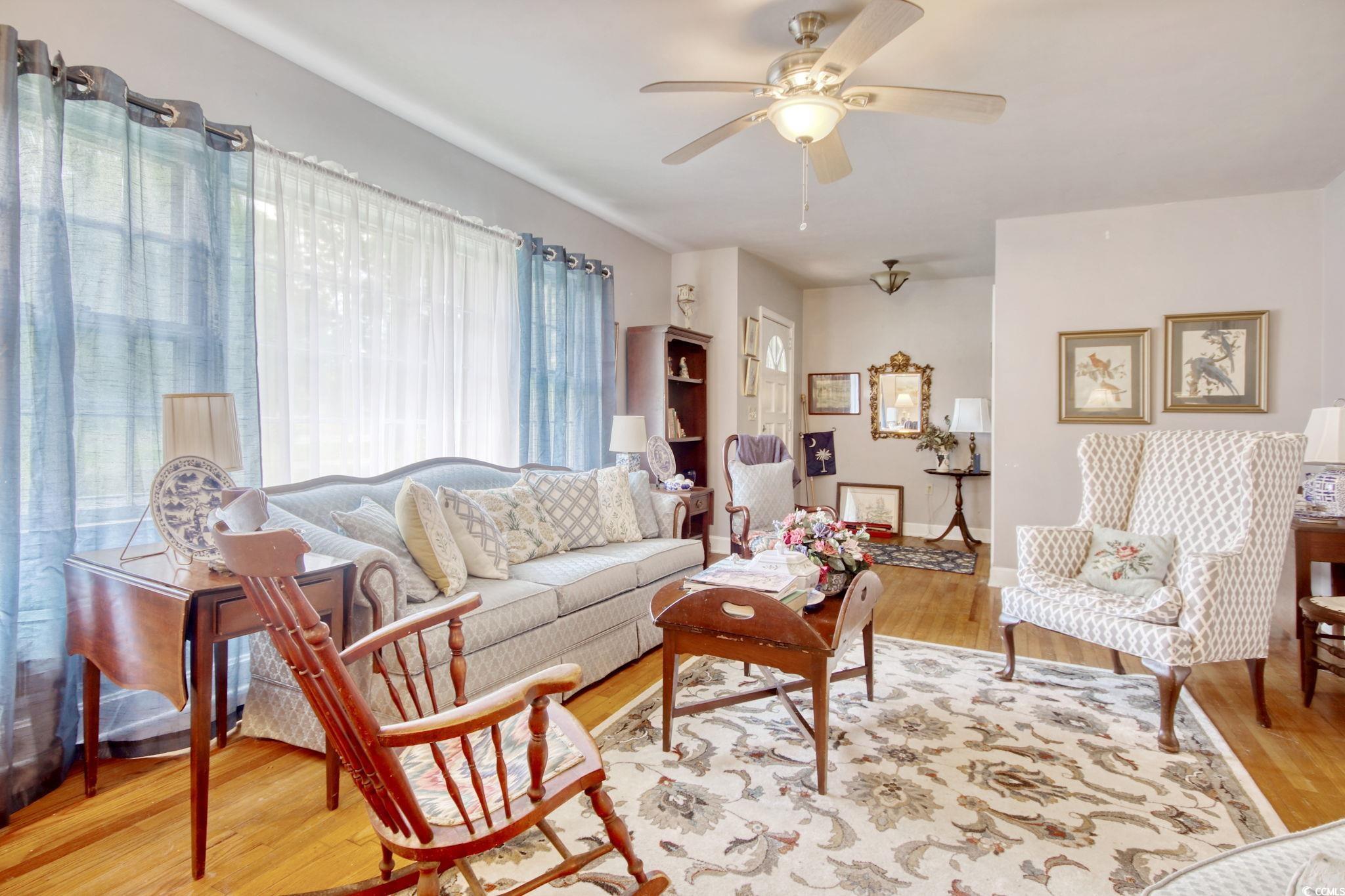 2004 Seitter Street Georgetown, SC 29440 - Photo 14 of 33 Living area featuring plenty of natural light, wood finished floors, and ceiling fan