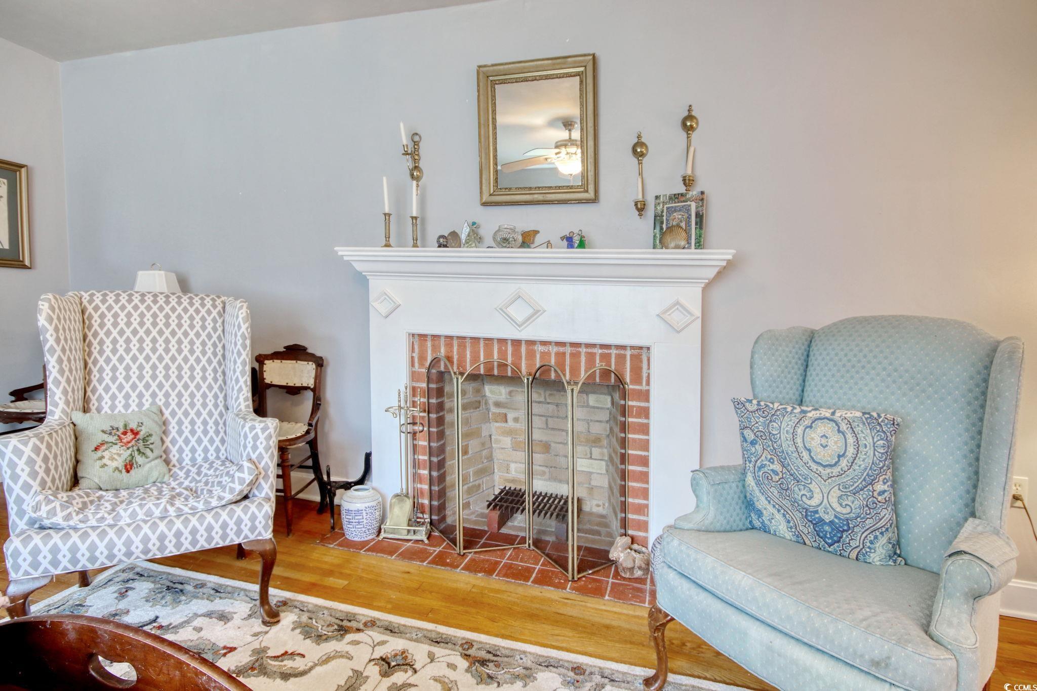 2004 Seitter Street Georgetown, SC 29440 - Photo 15 of 33 Sitting room featuring wood finished floors and a fireplace