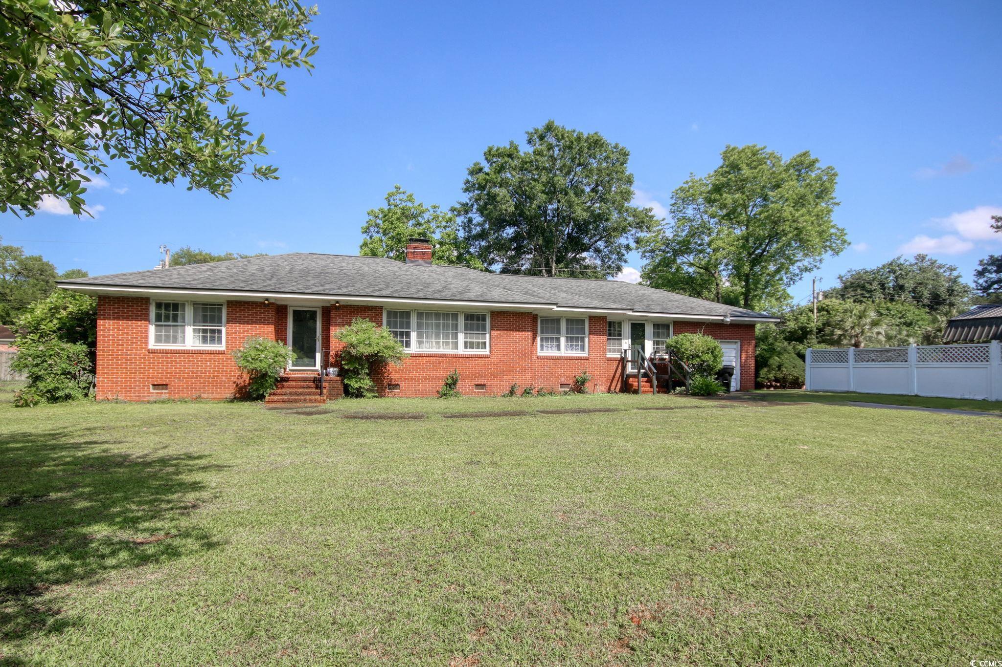 2004 Seitter Street Georgetown, SC 29440 - Photo 3 of 33 Ranch-style house with crawl space, brick siding, a chimney, and entry steps