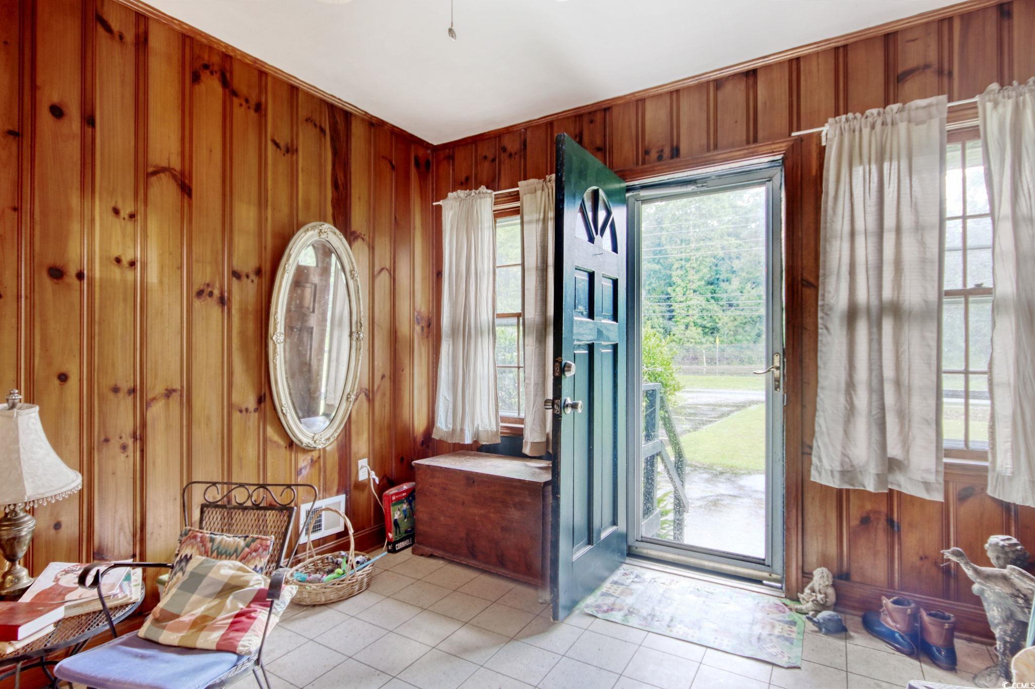 2004 Seitter Street Georgetown, SC 29440 - Photo 7 of 33 Entrance foyer featuring wooden walls and light tile patterned floors
