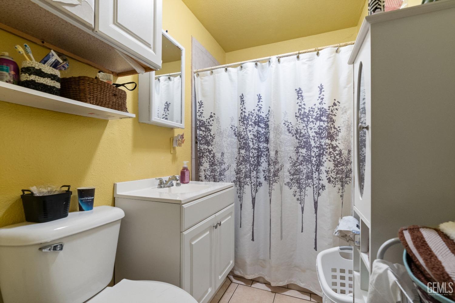 Undisclosed Address Bakersfield, CA 93305 - Photo 13 of 23 a bathroom with a sink toilet and shower