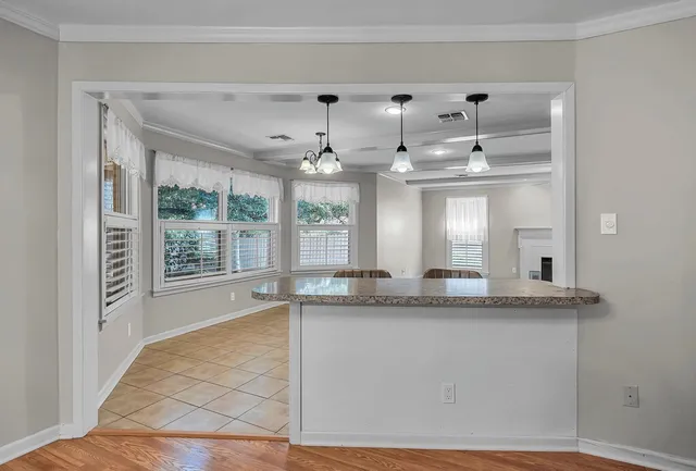 a bathroom with a granite countertop sink mirror and a bathtub