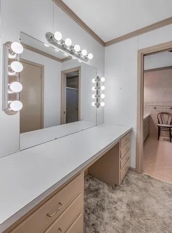 a view of a hallway with chandelier and chandelier