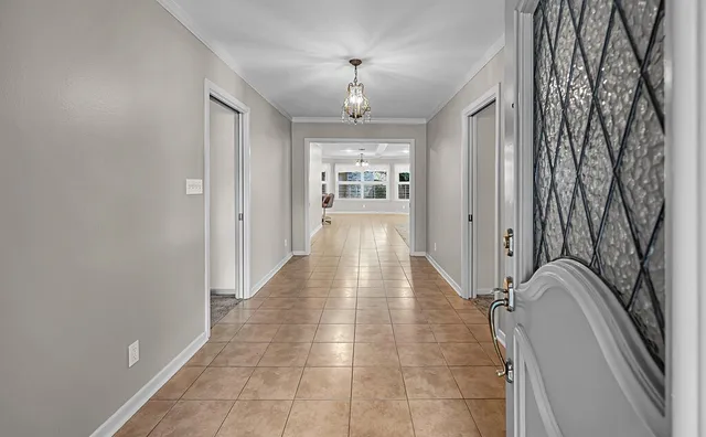 a hallway with sliding door and entryway