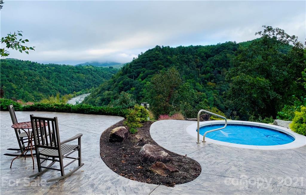 141 River Club Trail, Unit 8 Marshall, NC 28753 - Photo 16 of 27 a view of a swimming pool with a yard