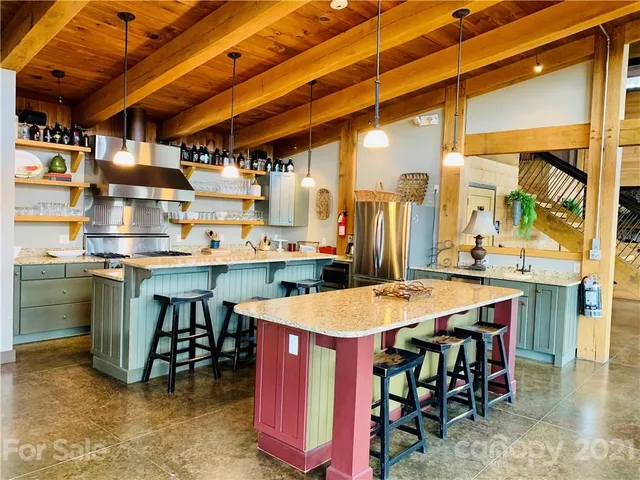a dining room with furniture and a flat screen tv