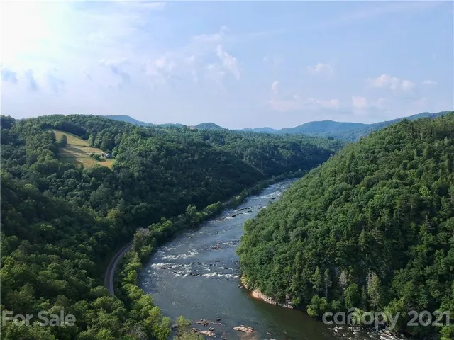 an aerial view of a houses with yard