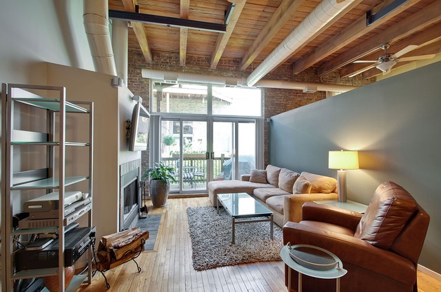 525 North Ada Street, Unit 27 Chicago, IL 60642 - Photo 4 of 18 a living room with furniture and a large window
