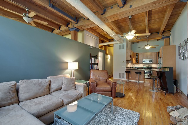 525 North Ada Street, Unit 27 Chicago, IL 60642 - Photo 5 of 18 a living room with furniture and kitchen view