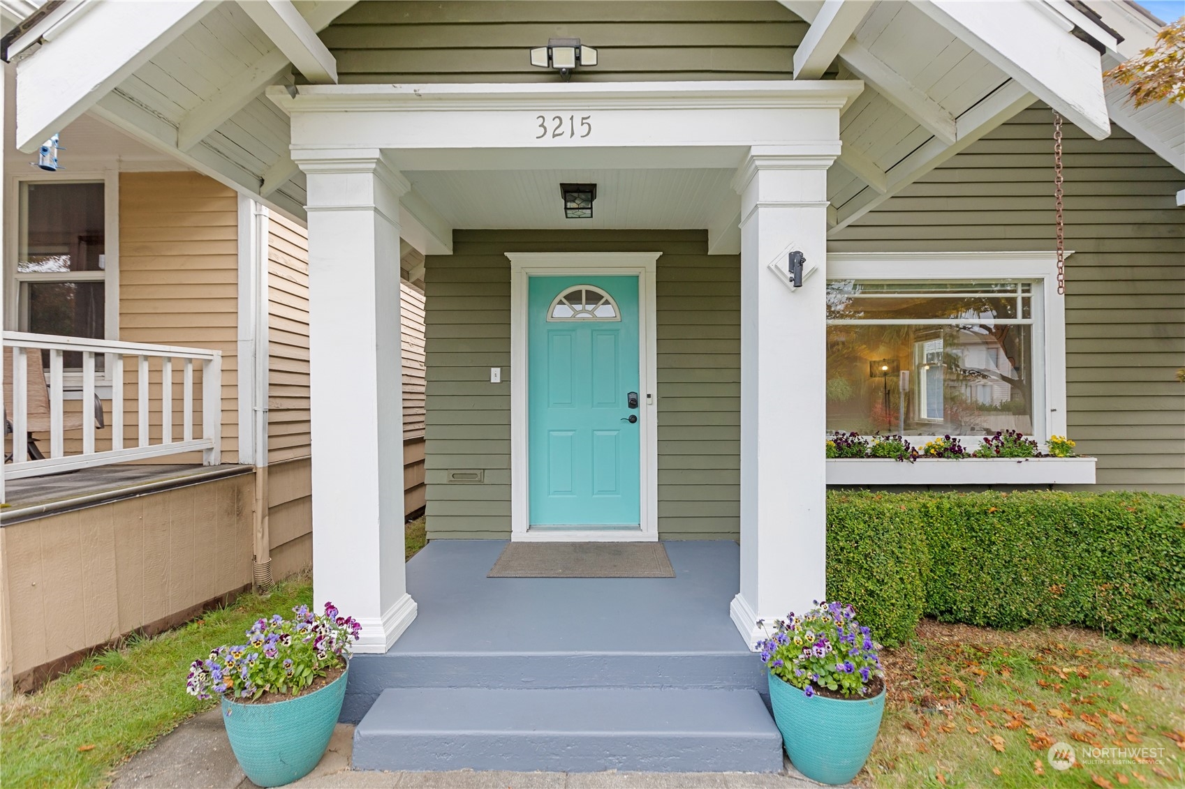 3215 Rockefeller Avenue Everett, WA 98201 - Photo 1 of 31 a front view of a house with a potted plant