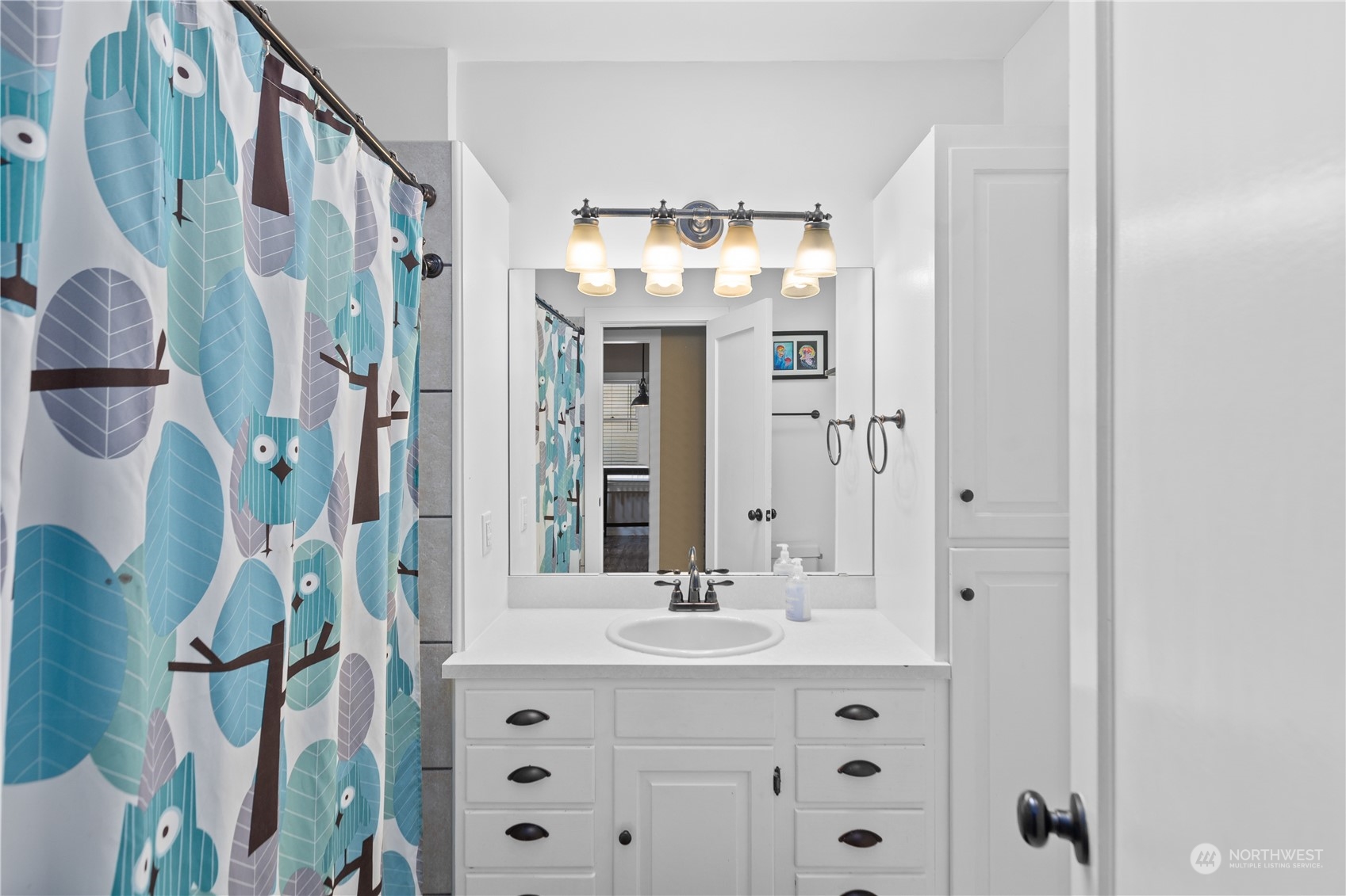 3215 Rockefeller Avenue Everett, WA 98201 - Photo 11 of 31 a bathroom with a sink vanity and a mirror