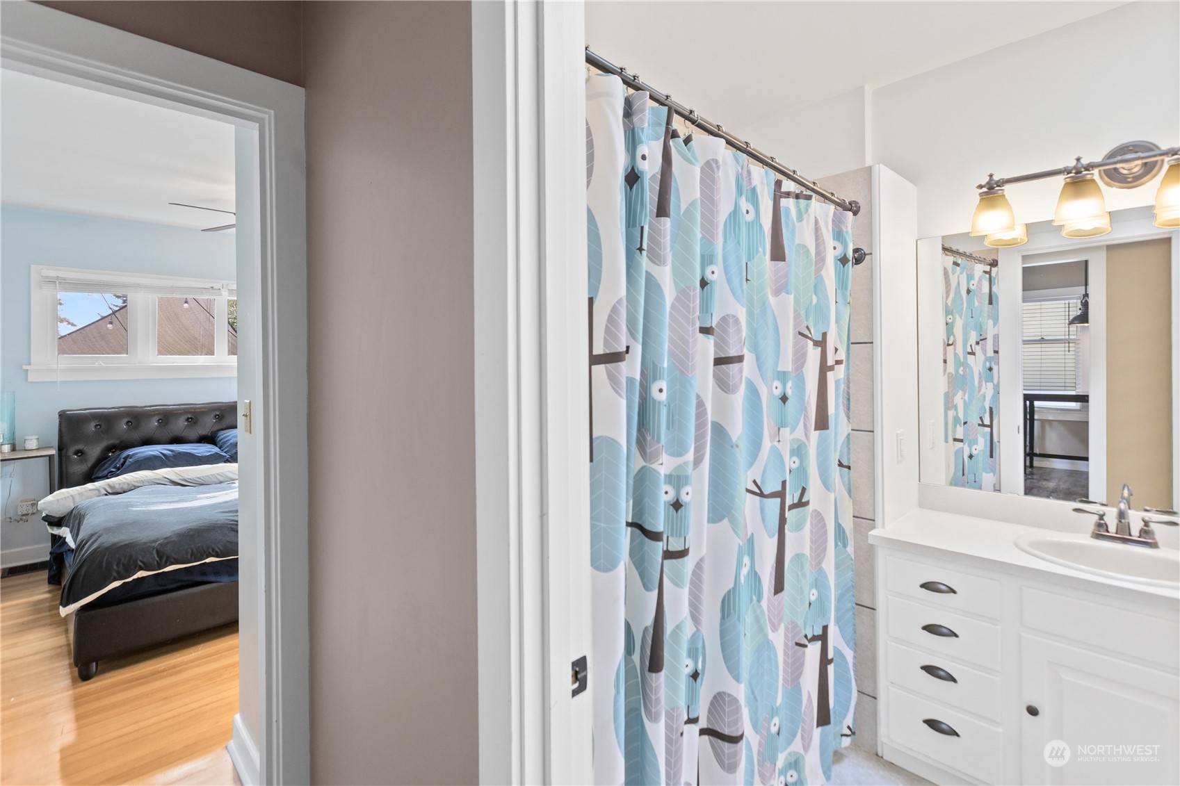 3215 Rockefeller Avenue Everett, WA 98201 - Photo 12 of 31 a en suite bathroom with a shower and a double vanity sink