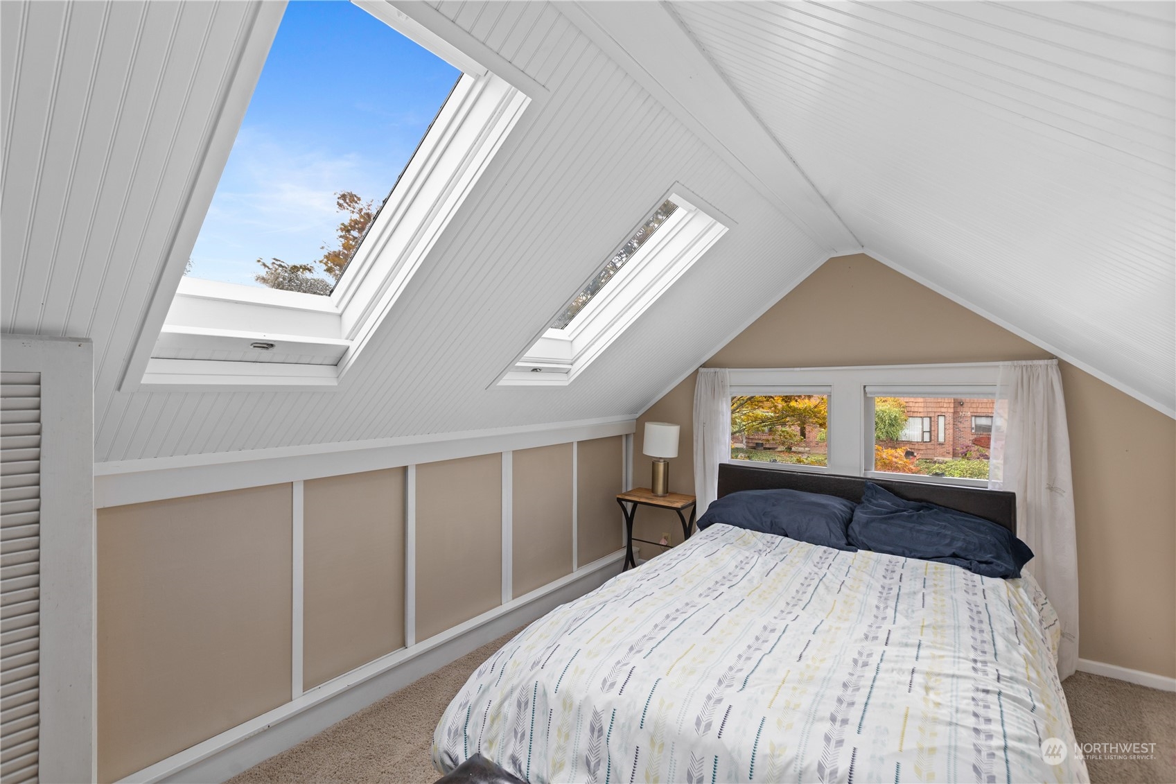 3215 Rockefeller Avenue Everett, WA 98201 - Photo 17 of 31 a bedroom with a bed and a large window