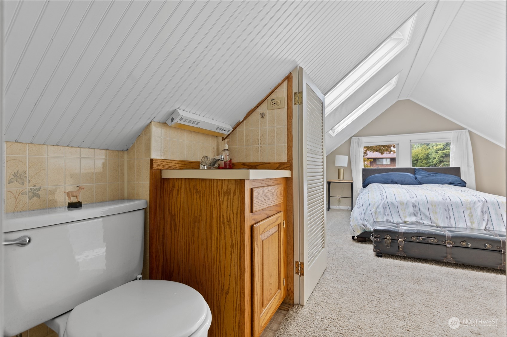3215 Rockefeller Avenue Everett, WA 98201 - Photo 18 of 31 a bedroom with a bed dresser and a window