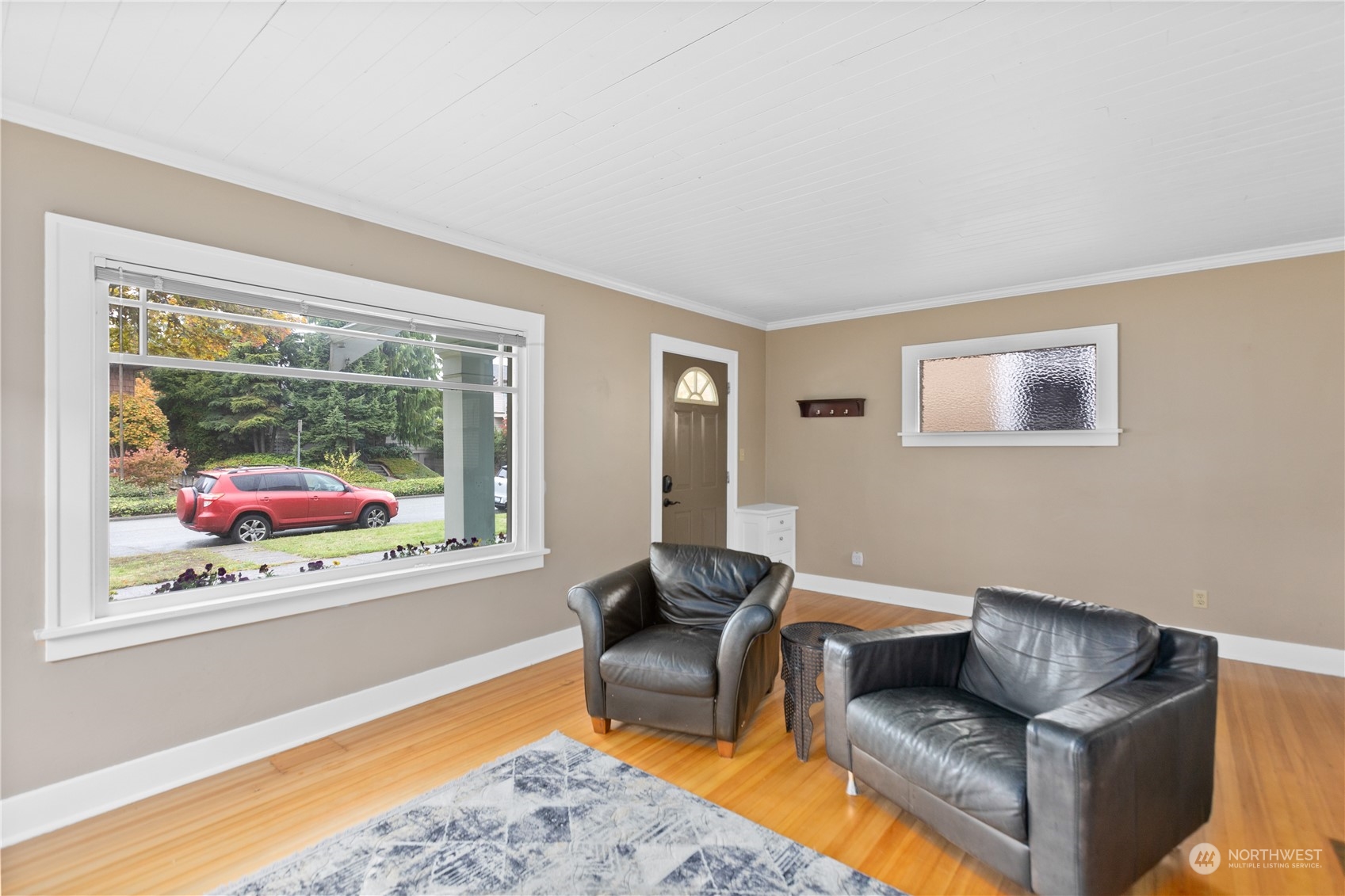 3215 Rockefeller Avenue Everett, WA 98201 - Photo 3 of 31 a living room with furniture and a large window