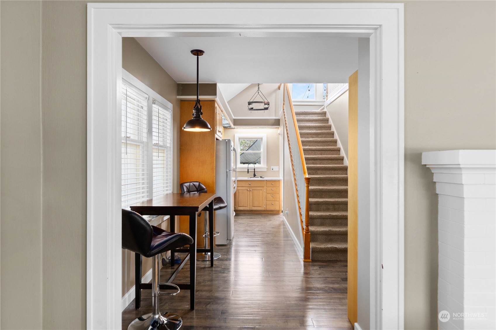 3215 Rockefeller Avenue Everett, WA 98201 - Photo 6 of 31 a view of a hallway with wooden floor and dining room