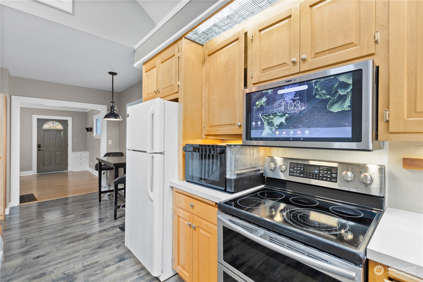3215 Rockefeller Avenue Everett, WA 98201 - Photo 10 of 31 a kitchen with a stove and a refrigerator