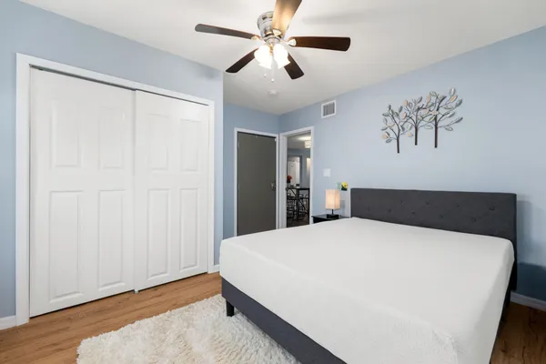 a bedroom with a bed and window