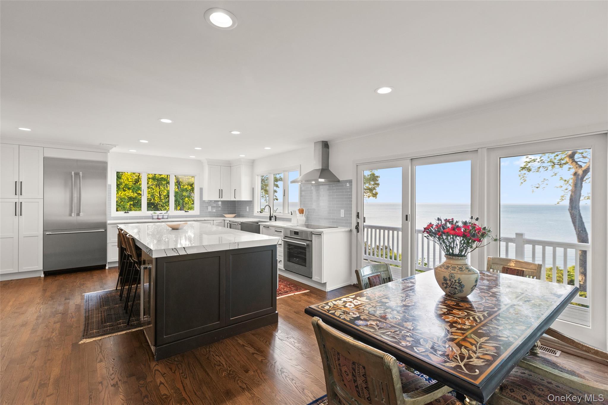 15 Stephens Path Port Jefferson, NY 11777 - Photo 13 of 34 a kitchen with stainless steel appliances granite countertop a sink dishwasher and a refrigerator