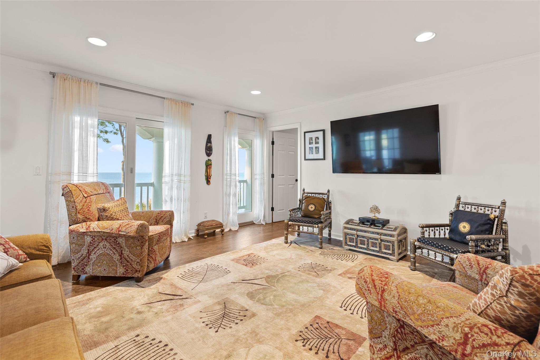 15 Stephens Path Port Jefferson, NY 11777 - Photo 15 of 34 a living room with furniture and a flat screen tv