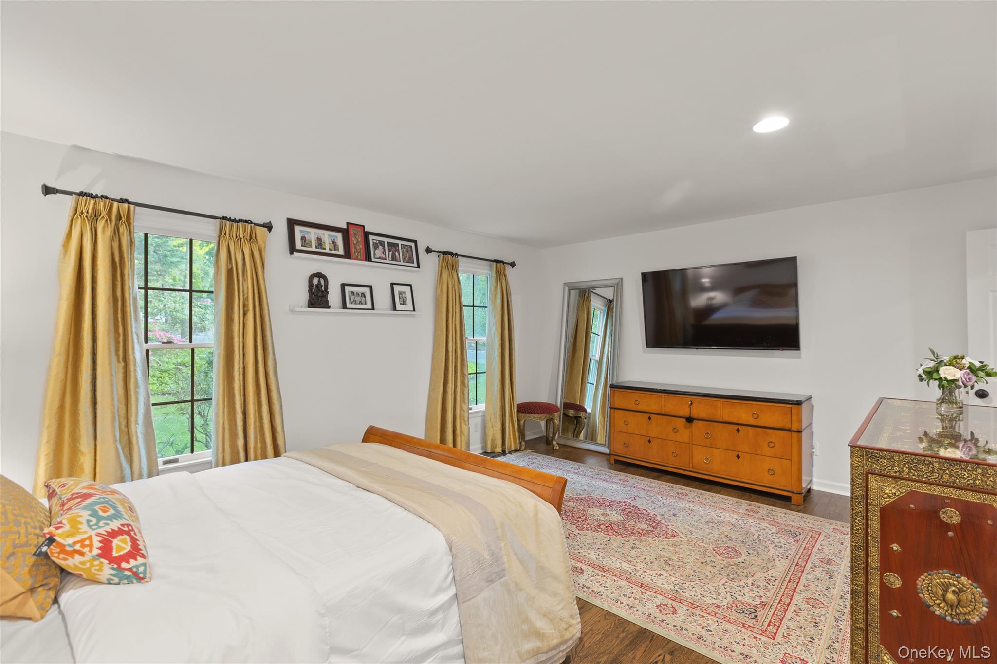 15 Stephens Path Port Jefferson, NY 11777 - Photo 17 of 34 a bedroom with a bed and a flat screen tv