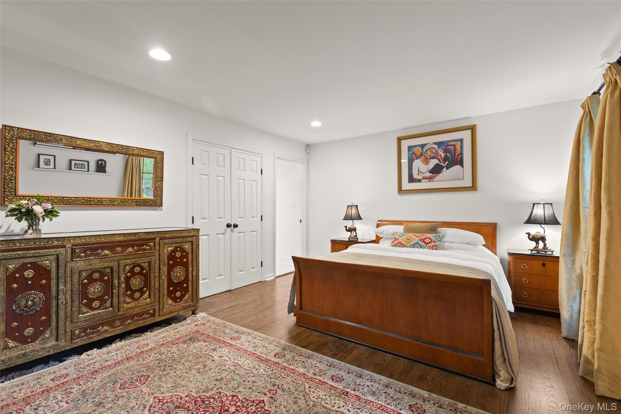 15 Stephens Path Port Jefferson, NY 11777 - Photo 18 of 34 a bedroom with a bed and cabinets